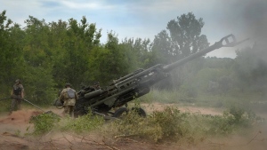 FILE - Ukrainian soldiers fire at Russian positions from a U.S.-supplied M777 howitzer in Ukraine's eastern Donetsk region, June 18, 2022. The deliveries of Western weapons have been crucial for Ukraine's efforts to fend off Russian attacks in the country's eastern industrial heartland of Donbas. The Western howitzers have some advantages compared to older Soviet-designed systems in the Russian and Ukrainian arsenals, but they require time for the Ukrainian crews to train how to operate them and their wide assortment poses obvious logistical challenges. (AP Photo/Efrem Lukatsky, File)