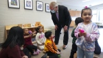 Ontario is considering new ways to fund the national $10-a-day child-care program in the province as it seeks to address operator concerns in an ongoing bid to increase uptake, particularly from the for-profit sector. Ontario Premier Doug Ford, centre, visits a daycare centre after reaching and agreement with the federal government in $10-a-day child-care program deal in Brampton, Ont., on Monday, March 28, 2022. THE CANADIAN PRESS/Nathan Denette