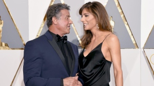 FILE - Sylvester Stallone, left, and Jennifer Flavin arrive at the Oscars on Sunday, Feb. 28, 2016, at the Dolby Theatre in Los Angeles. Stallone's wife Jennifer Flavin Stallone has filed for divorce after 25 years of marriage. She filed a petition to end the marriage last week in a court in Palm Beach County, Fla., where the couple owns a home. (Photo by Dan Steinberg/Invision/AP, File)