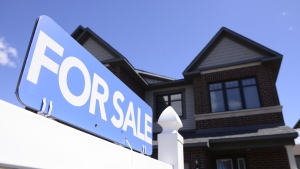 A new home is displayed for sale, in Ottawa on Tuesday, July 14, 2020. After fuelling Canada's economy through the COVID-19 pandemic, the real estate market is showing signs of weakness as home prices fall and bidding wars dissipate.THE CANADIAN PRESS/Sean Kilpatrick