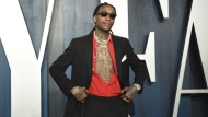 FILE - Wiz Khalifa arrives at the Vanity Fair Oscar Party on Sunday, Feb. 9, 2020, in Beverly Hills, Calif. Police say rapper Wiz Khalifa cut short a concert in suburban Indianapolis as people began fleeing the outdoor venue Friday night, Aug. 26, 2022, leaving three with minor injuries, following a disturbance. People started exiting the Ruoff Music Center in Noblesville about 10:30 p.m. after a reported disturbance on part of the amphitheater’s lawn (Photo by Evan Agostini/Invision/AP, File)