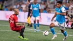 Charlotte FC defender Jaylin Lindsey, right, takes the ball past Toronto FC midfielder Lorenzo Insigne, left, during the first half of an MLS soccer match, Saturday, Aug. 27, 2022, in Charlotte, N.C. (AP Photo/Matt Kelley)