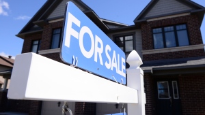 A new home is displayed for sale, in Ottawa on Tuesday, July 14, 2020. THE CANADIAN PRESS/Sean Kilpatrick