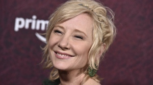FILE - Anne Heche arrives at the premiere of "The Tender Bar" at the TCL Chinese Theatre, on Dec. 12, 2021, in Los Angeles. The coroner's office says actor Heche died from burns and inhalation injury after her fiery car crash and the death has been ruled an accident. The cause of her death was released on the Los Angeles County coroner's website Wednesday, Aug. 17, 2022, although a formal autopsy report is still being completed. (Photo by Jordan Strauss/Invision/AP, File)