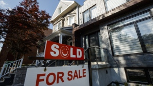 A sold sign sits in front of a house in Toronto on Tuesday July 12, 2022. The Toronto Regional Real Estate Board says August sales were down 34 per cent since last year, but up almost 15 per cent from July, as buyers returned to the market to take advantage of prices that eased from winter’s elevated levels. THE CANADIAN PRESS/Cole Burston