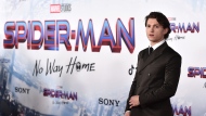 FILE - Tom Holland arrives at the premiere of "Spider-Man: No Way Home" at the Regency Village Theater on Monday, Dec. 13, 2021, in Los Angeles. 'Spider-Man: No Way Home' has swung back on top of the box office during a holiday weekend where American theaters aimed to lure moviegoers with discounted $3 tickets. The first 'National Cinema Day' nationwide promotion appeared to work with the highest-attended day of the year, drawing an estimated 8.1 million moviegoers on Saturday, Sept. 3, 2022, according to The Cinema Foundation. (Photo by Jordan Strauss/Invision/AP, File) 
