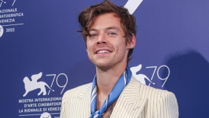 Harry Styles poses for photographers at the photo call for the film 'Don't Worry Darling' during the 79th edition of the Venice Film Festival in Venice, Italy, Monday, Sept. 5, 2022. (Photo by Joel C Ryan/Invision/AP)