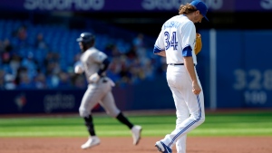Toronto Blue Jays starting pitcher Kevin Gausman (34) hangs his head as Tampa Bay Rays' Yandy Diaz rounds the bases on his three run home-run during second inning MLB baseball action in Toronto, Thursday, Sept. 15, 2022. THE CANADIAN PRESS/Frank Gunn