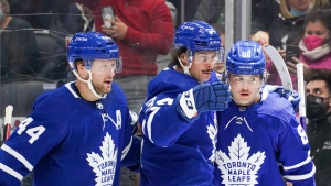 Toronto Maple Leafs defenceman Morgan Rielly (44), Auston Matthews (34) and William Nylander (88) celebrate a goal against the Vegas Golden Knights during second period NHL action on Tuesday, November 2, 2021. Auston Matthews believes those deep, painful battle scars of playoff failures past will eventually — finally — pay dividends.THE CANADIAN PRESS/Evan Buhler