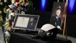 Items belonging to Const. Andrew Hong are displayed in the Toronto Congress Centre during his funeral in Toronto on Wednesday, Sept. 21, 2022. Const. Hong was shot dead last week while on break during a training session in what police are calling an ambush attack. THE CANADIAN PRESS/Frank Gunn 