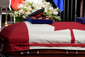 The police hat of Const. Andrew Hong rests on his casket during his funeral service in Toronto on Wednesday, Sept. 21, 2022. Const. Hong was shot dead last week in Mississauga in what police are calling an ambush attack. THE CANADIAN PRESS/Frank Gunn 