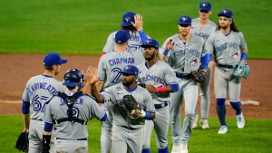 Toronto Blue Jays players celebrate after the second game of a baseball doubleheader against the Baltimore Orioles, Monday, Sept. 5, 2022, in Baltimore. (AP Photo/Julio Cortez) 
