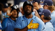Tampa Bay Rays' Randy Arozarena reacts in the dugout after hitting a three-run home against the Toronto Blue Jays during the fifth inning of a baseball game Friday, Sept. 23, 2022, in St. Petersburg, Fla. (AP Photo/Scott Audette)