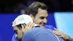 Team Europe's Matteo Berrettini, of Italy, celebrates with Roger Federer of Switzerland, after winning a match against Team World's Felix Auger-Aliassime, of Canada, on second day of the Laver Cup tennis tournament at the O2 in London, Saturday, Sept. 24, 2022. (AP Photo/Kin Cheung)