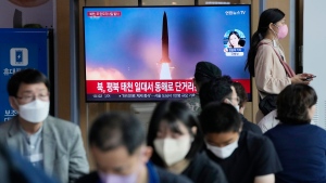 A file image of a missile launch by North Korea is shown on a news program at the Seoul Railway Station in Seoul, South Korea, Sunday, Sept. 25, 2022. North Korea fired a short-range ballistic missile Sunday toward its eastern seas, extending a provocative streak in weapons testing as a U.S. aircraft carrier visits South Korea for joint military exercises in response to the North's growing nuclear threat.(AP Photo/Ahn Young-joon)