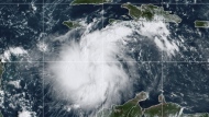 This satellite image provided by the National Oceanic and Atmospheric Administration shows Tropical Storm Ian over the central Caribbean on Saturday, Sept. 24, 2022. (NOAA via AP)