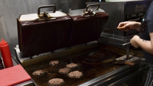 Burgers cooking at Zing Burger store in Budapest