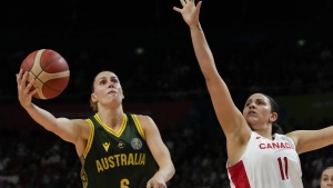 Australia's Steph Talbot shoots as Canada's Natalie Achonwa defends during their game at the women's Basketball World Cup in Sydney, Australia, Monday, Sept. 26, 2022. THE CANADIAN PRESS/AP/Mark Baker