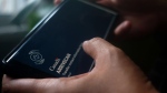 A person holds a smartphone set to the opening screen of the ArriveCan app in a photo illustration made in Toronto on June 29, 2022. The federal government announced on Monday that starting Oct. 1, all COVID-19 entry restrictions will be removed, including testing, quarantine and isolation requirements for anyone entering Canada. THE CANADIAN PRESS/Giordano Ciampini