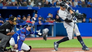 New York Yankees right fielder Aaron Judge (99) hits a single to right field against the Toronto Blue Jays during first inning American League MLB baseball action in Toronto on Monday, September 26, 2022. THE CANADIAN PRESS/Nathan Denette