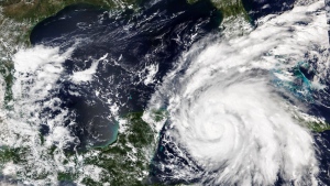 This Sept. 26, 2022, satellite image released by NASA shows Hurricane Ian growing stronger as it barreled toward Cuba. Ian was forecast to hit the western tip of Cuba as a major hurricane and then become an even stronger Category 4 with top winds of 140 mph (225 km/h) over warm Gulf of Mexico waters before striking Florida. (NASA Worldview/Earth Observing System Data and Information System (EOSDIS) via AP)