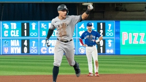 New York Yankees designated hitter Aaron Judge (99) rounds the bases after hitting his 61st home run of the season, a two-run shot, against the Toronto Blue Jays during seventh inning American League MLB baseball action in Toronto on Wednesday, September 28, 2022. THE CANADIAN PRESS/Alex Lupul