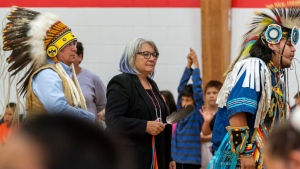Governor General of Canada Mary Simon, middle, joins dancers during a visit to Bernard Constant Community School at James Smith Cree Nation, Sask., on Wednesday, Sept. 28, 2022. Simon is to be among those speaking at a Truth and Reconciliation event in Regina today. THE CANADIAN PRESS/Heywood Yu