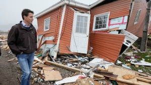 Prime Minister Justin Trudeau tours the damage caused by post-tropical storm Fiona in Port aux Basques, N.L. on Wednesday, Sept. 28, 2022. THE CANADIAN PRESS/Frank Gunn