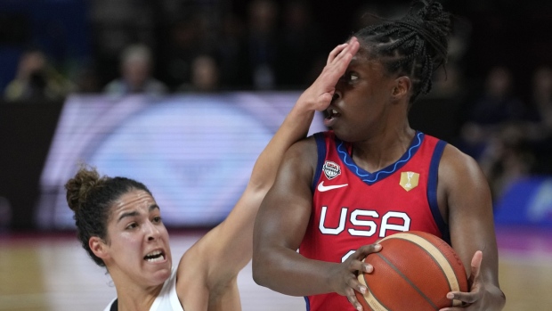 Canada's Kia Nurse, left, covers the face of United States' Chelsea Gray during their semifinal game at the women's Basketball World Cup in Sydney, Australia, Friday, Sept. 30, 2022. (AP Photo/Rick Rycroft)