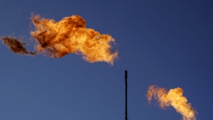 FILE - Flares burn off methane and other hydrocarbons at an oil and gas facility in Lenorah, Texas, Friday, Oct. 15, 2021. Climate scientists have found that methane emissions from the oil and gas industry are far worse than what companies are reporting, despite claims by some major firms that they’ve reduced their emissions. (AP Photo/David Goldman, File)