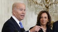 President Joe Biden responds to a question about Russia during a reception to celebrate the Jewish new year in the East Room of the White House in Washington, Friday, Sept. 30, 2022. Vice President Kamala Harris listens at right. (AP Photo/Susan Walsh)