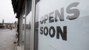 A sign announces a store will open soon Thursday April 30, 2020 in Ottawa. Equifax says new business openings in the second quarter of 2022 were almost 50 per cent down compared to a year ago.THE CANADIAN PRESS/Adrian Wyld