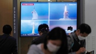 FILE - A TV screen shows files image of North Korea's missile launch during a news program at the Seoul Railway Station in Seoul, South Korea, Thursday, Sept. 29, 2022. (AP Photo/Ahn Young-joon) 