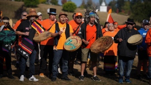 First Nations drummers sing and drum as they lead a march to begin a ceremony to mark the National Day for Truth and Reconciliation, at the site of the former St. Mary's Indian Residential School in Mission, B.C., on Friday, September 30, 2022. THE CANADIAN PRESS/Darryl Dyck