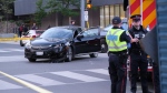 Toronto police say a motorcyclist and a pedestrian has been hospitalized after a collision downtown. (Simon Sheehan/CP24)