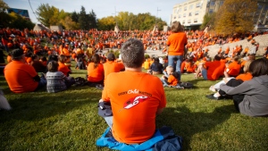 People attend the second annual Orange Shirt Day Survivors Walk and Pow Wow on National Day for Truth and Reconciliation in Winnipeg, Friday, September 30, 2022. THE CANADIAN PRESS/John Woods