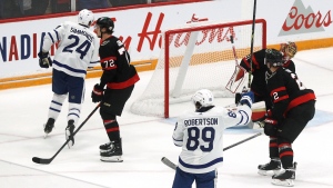 Toronto Maple Leafs' Nicholas Robertson (89) and Wayne Simmonds (24) celebrate a goal against the Ottawa Senators during third NHL pre-season action at the CAA arena in Belleville, Ont., on Friday, September 30, 2022. THE CANADIAN PRESS/Lars Hagberg