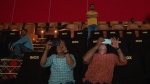 Journalists record with their cellphone as engineers play a trailer of a Bollywood movie to check for sound and picture quality ahead of the inauguration of 'INOX' multiplex in Srinagar, Indian controlled Kashmir, Monday, Sept. 19, 2022. The multi-screen cinema hall has opened in the main city of Indian-controlled Kashmir for public for the first time in 14 years. The 520-seat hall with three screens opened on Saturday, Oct. 1, amid elaborate security but only about a dozen viewers lined up for the first morning show. (AP Photo/Dar Yasin)
