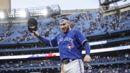 Toronto Blue Jays catcher Danny Jansen (9) is doused with water after the Toronto Blue Jays defeated the Boston Red Sox in AL MLB baseball action, in Toronto on Saturday, October 1, 2022. THE CANADIAN PRESS/Christopher Katsarov