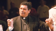 FILE - Bishop Carlos Ximenes Belo of East Timor, sings along with participants at the National Catholic Gathering for Jubilee Justice held on the UCLA Campus in Los Angeles, on July 17, 1999. Belo has been accused in a Dutch magazine article of sexually abusing boys in East Timor in the 1990s, rocking the Catholic Church in the impoverished nation and forcing officials at the Vatican and his religious order to scramble to provide answers. (AP Photo/Neil Jacobs, File)