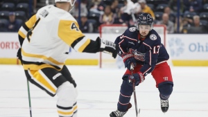 Columbus Blue Jackets' Johnny Gaudreau, right, looks for an open pass against the Pittsburgh Penguins during the second period of a preseason NHL hockey game Sunday, Sept. 25, 2022, in Columbus, Ohio. (AP Photo/Jay LaPrete)