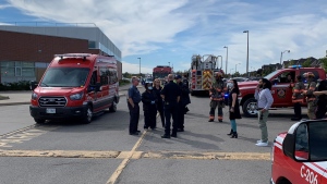 Firefighters are shown outside a Brampton secondary school during an unknown substance investigation on Tuesday. (Twitter/@BramptonFireES)