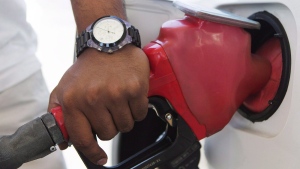 A person pumps fuel in Toronto after gasoline prices rose overnight on Wednesday, September 12, 2012. Gasoline prices in Canada continue to creep higher ahead of the Thanksgiving long weekend.THE CANADIAN PRESS/Michelle Siu