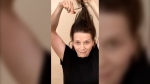 In this image taken from video, Oscar-winning actress Juliette Binoche chops off a lock of her hair to support Iranian protesters standing up to their leadership over the death of Mahsa Amini. Amini, a 22-year-old woman who died in Iran while in police custody, was arrested by Iran's morality police for allegedly violating its strictly-enforced dress code.