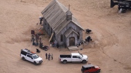 FILE - This aerial photo shows part of the Bonanza Creek Ranch film set in Santa Fe, N.M., on Saturday, Oct. 23, 2021, where cinematographer Halyna Hutchins died from a gun fired by actor Alec Baldwin. The family of a cinematographer shot and killed by Alec Baldwin on the set of the film “Rust” has agreed to settle a lawsuit against Baldwin and the movie's producers, and production will resume on the project. (AP Photo/Jae C. Hong, File)