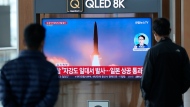 FILE - A TV screen showing a news program reporting about North Korea's missile launch with file image, is seen at the Seoul Railway Station in Seoul, South Korea, Tuesday, Oct. 4, 2022. (AP Photo/Lee Jin-man) 