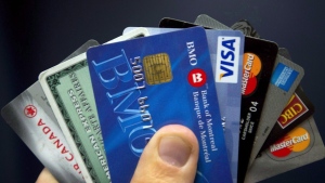 Credit cards are displayed in Montreal on December 12, 2012. Canadians may see a jump in the number of businesses adding credit card surcharges as restrictions on the practice lift. THE CANADIAN PRESS/Ryan Remiorz