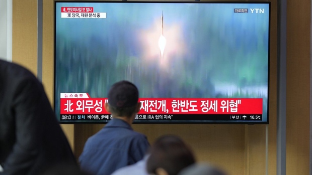 FILE - A TV screen showing a news program reporting about North Korea's missile launch with file footage, is seen at the Seoul Railway Station in Seoul, South Korea on Oct. 6, 2022. The nuclear-powered aircraft carrier USS Ronald Reagan launched a new round of naval drills with South Korean warships on Friday, a day after North Korea fired more ballistic missiles and flew warplanes in an escalation of its weapons tests. (AP Photo/Lee Jin-man, File)