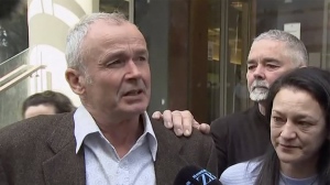 In this image made from a video, Mark Ellis, left, brother of Peter Ellis, speaks to the media outside a court in Wellington Friday, Oct. 7, 2022. New Zealand’s Supreme Court found there had been a substantial miscarriage of justice after Peter Ellis was convicted of sexually abusing children at the daycare center where he worked as a teacher more than 30 years ago. (TVNZ via AP)