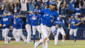 Toronto Blue Jays' Edwin Encarnacion celebrates after hitting a walk-off three-run home run during 11th inning American League wild-card game action against the Baltimore Orioles in Toronto, Tuesday, Oct. 4, 2016. The old single wild-card game format had its share of critics, but it frequently delivered the drama.THE CANADIAN PRESS/Mark Blinch